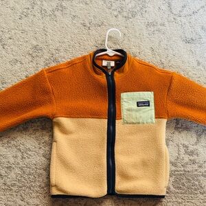 Patagonia Orange and Cream Fleece with Green Accent